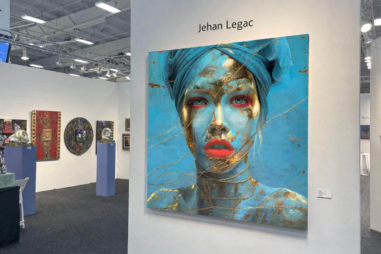 Artwork by Jehan Legac exhibited at ArtExpo, displayed in a gallery setting with focused lighting highlighting its details and texture.