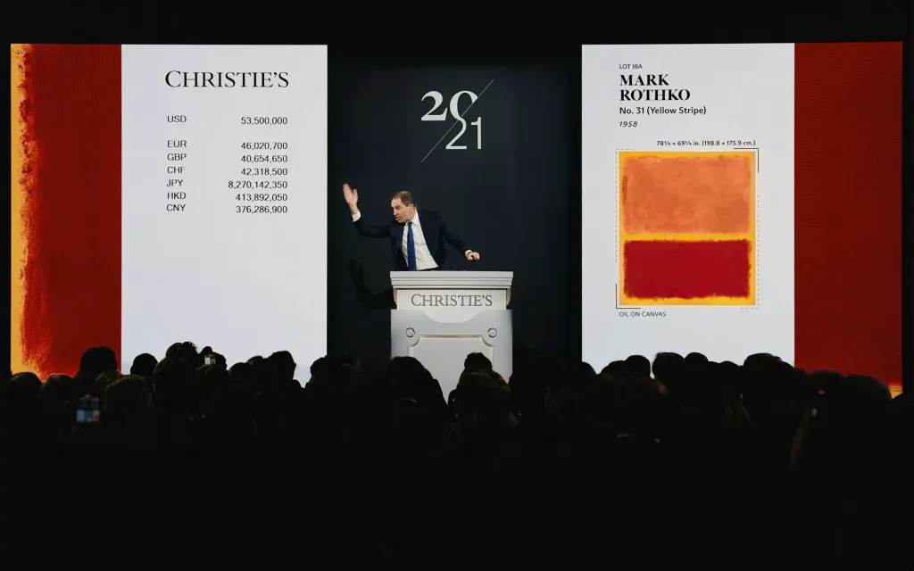 Adrien Meyer sells the top lot of The Collection of Robert F. and Patricia G Ross Weis, Mark Rothko's No. 31 (Yellow Stripe) for $62.1 million at Christie's. Courtesy of Christie's Images Ltd.